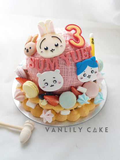 VANLILY CAKE 卡通扑扑蛋糕：粉紅球體外殼配可愛公仔糖片，內含 10 件迷你 Cupcake 及馬卡龍裝飾，派對驚喜蛋糕首選
